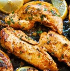 Delicious Garlic Butter Chicken Tenders served with herbs and spices.