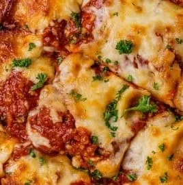 Delicious homemade lasagna layered with cheese and sauce