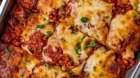 Delicious homemade lasagna layered with cheese and sauce