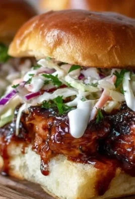 Honey Chipotle Garlic Chicken Sliders with fresh toppings on a serving platter