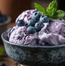 Keto Blueberry Ice Cream with cottage cheese in a bowl, topped with fresh blueberries