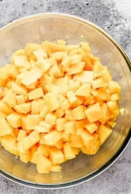Delicious mango salsa served in a bowl with chips on the side