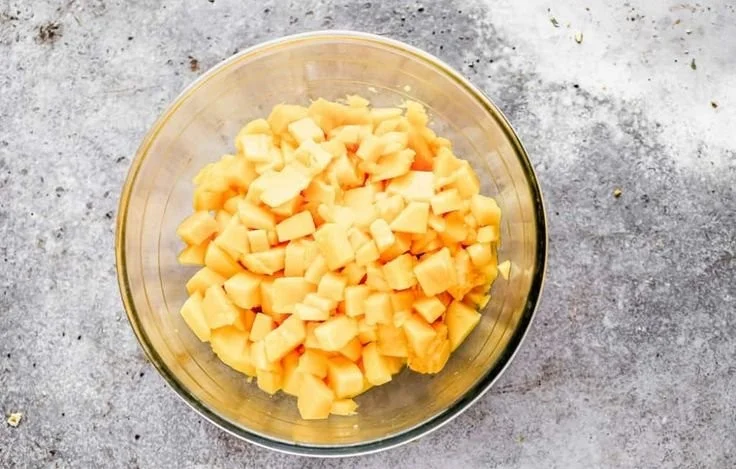 Delicious mango salsa served in a bowl with chips on the side