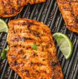 Delicious Mexican Chicken breast served with spices and vibrant toppings