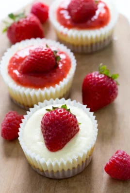 Delicious mini cheesecake cupcakes topped with creamy frosting.