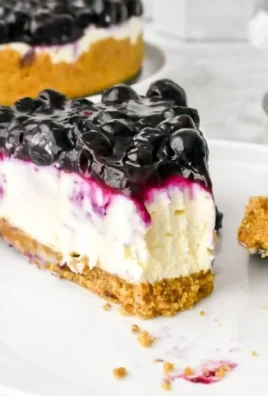 No bake blueberry cheesecake topped with fresh blueberries and creamy filling