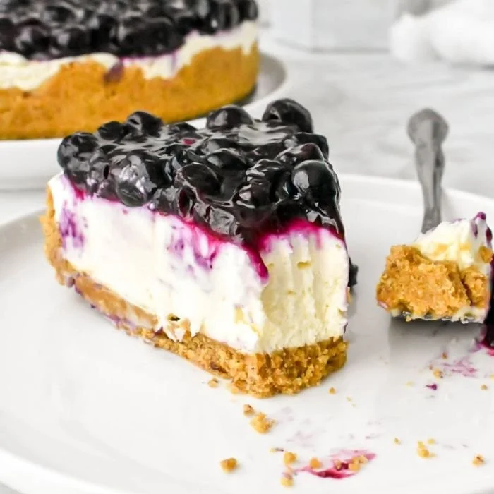 No bake blueberry cheesecake topped with fresh blueberries and creamy filling