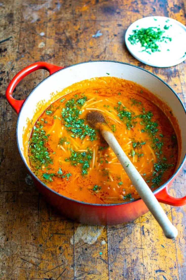 Delicious bowl of steaming noodle soup with fresh ingredients