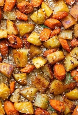 Oven roasted carrots and potatoes served on a platter, garnished and ready to eat.