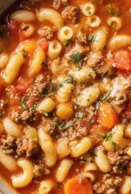 Delicious bowl of Pasta and Beans Soup garnished with herbs