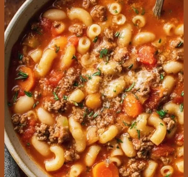 Delicious bowl of Pasta and Beans Soup garnished with herbs