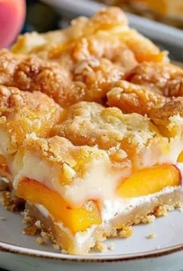 Peach Cobbler Cheesecake Bars with fresh peaches and creamy cheesecake layer