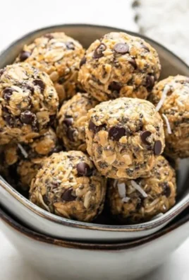 Homemade peanut butter energy bites on a wooden surface