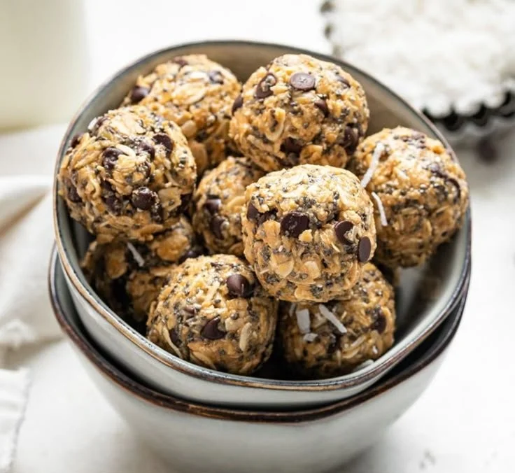 Homemade peanut butter energy bites on a wooden surface