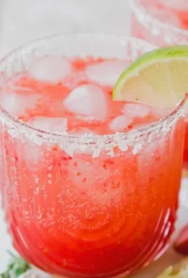 Strawberry Lime Mocktail Margarita served in a glass with fresh strawberries