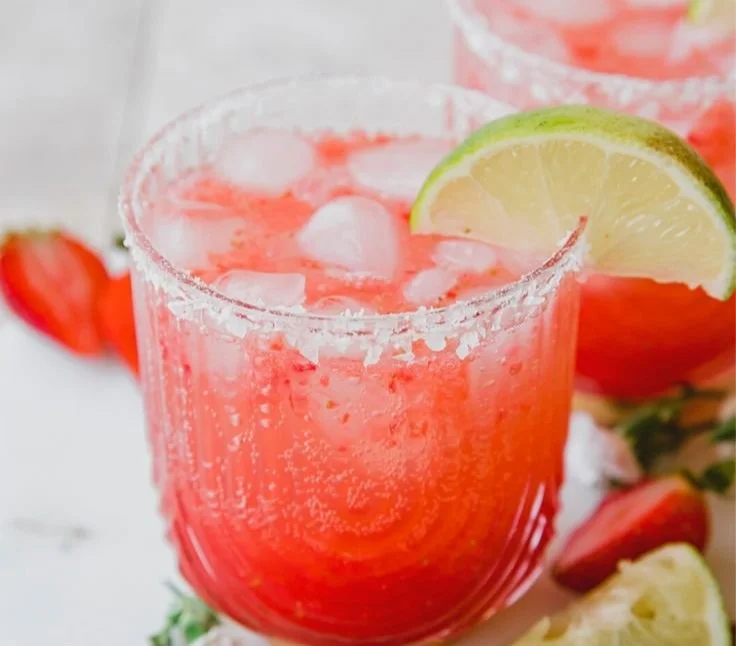 Strawberry Lime Mocktail Margarita served in a glass with fresh strawberries