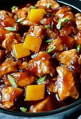 Delicious Sweet Hawaiian Crockpot Chicken served with rice and pineapple