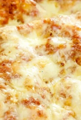Delicious cheese lasagna ready to be served, featuring layers of cheese and pasta