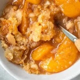 Southern peach cobbler with fresh peaches and a golden crust