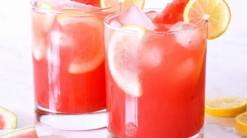 Refreshing watermelon lemonade in a glass with ice and lemon slices