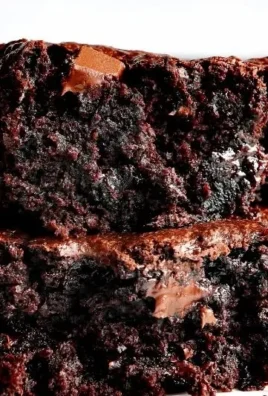 Delicious zucchini brownies with chocolate frosting on a plate