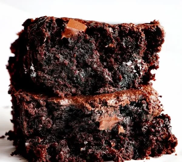 Delicious zucchini brownies with chocolate frosting on a plate